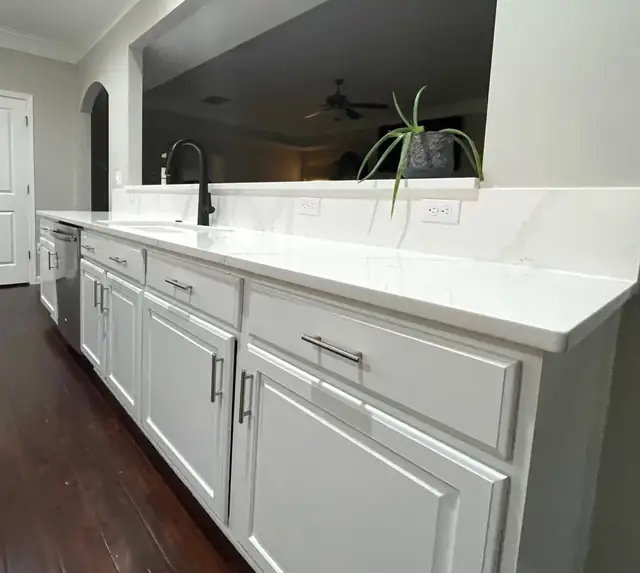 Clayton, NC kitchen remodel with white raised-panel cabinets and white quartz counters
